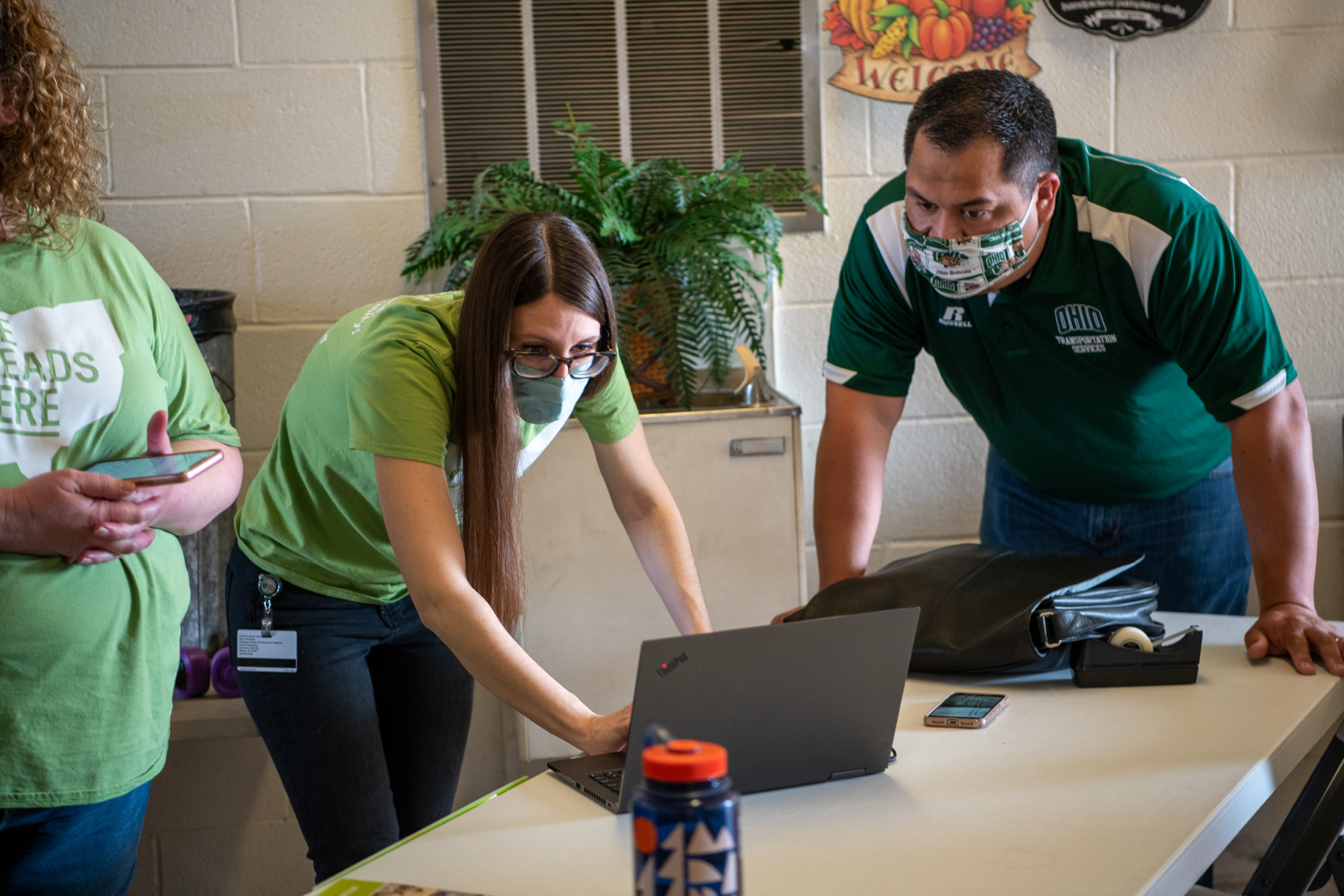 People checking a computer for accurate information