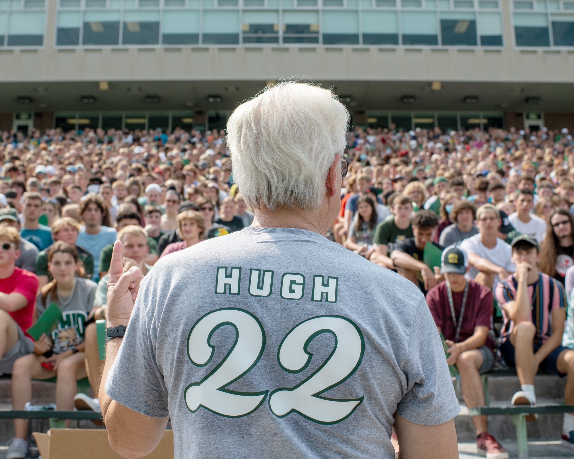 The back of President Sherman is seen as he addresses the incoming freshman crowd in Peden Stadium