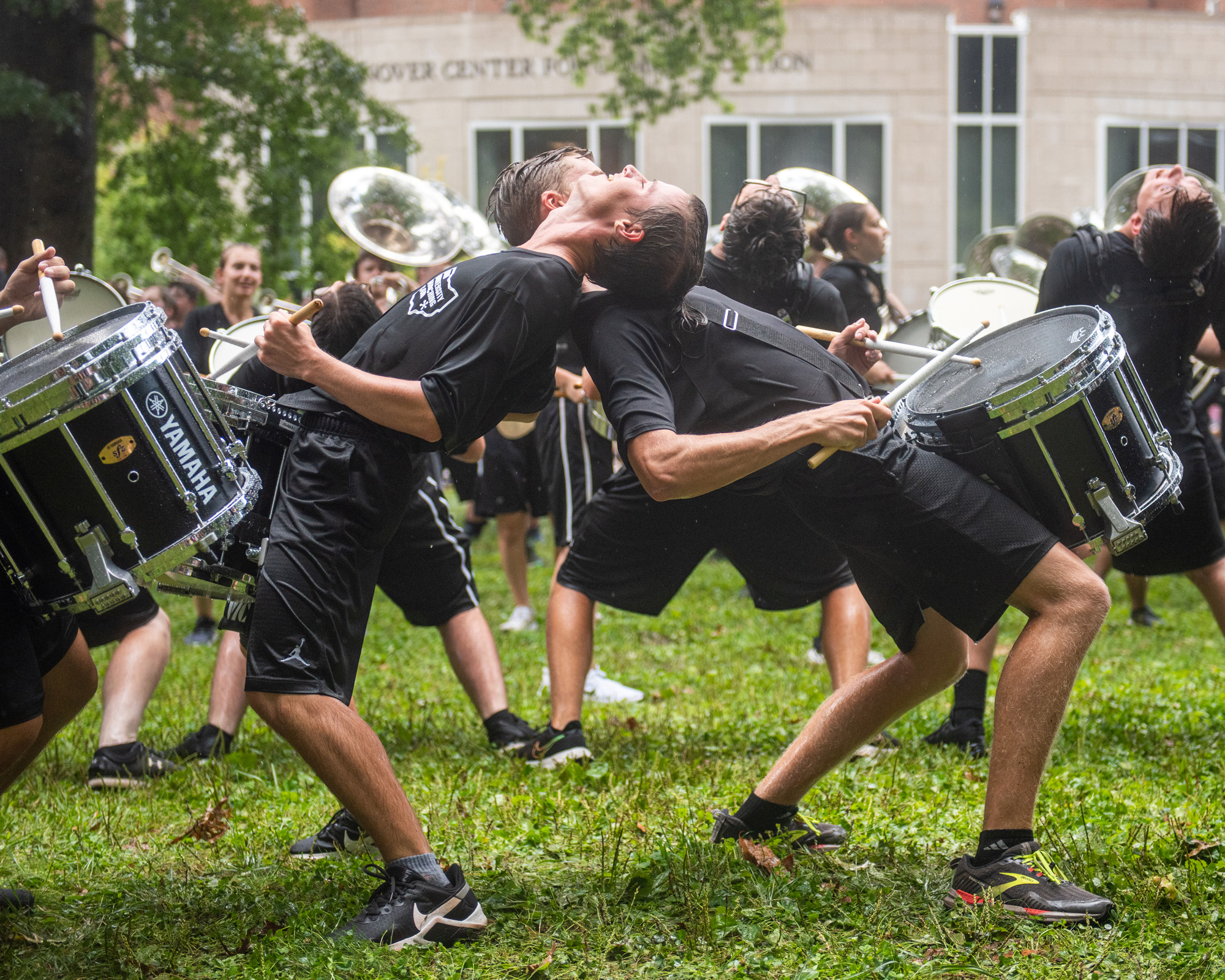 The OHIO Marching 110 drum line performs in the rain on College Green