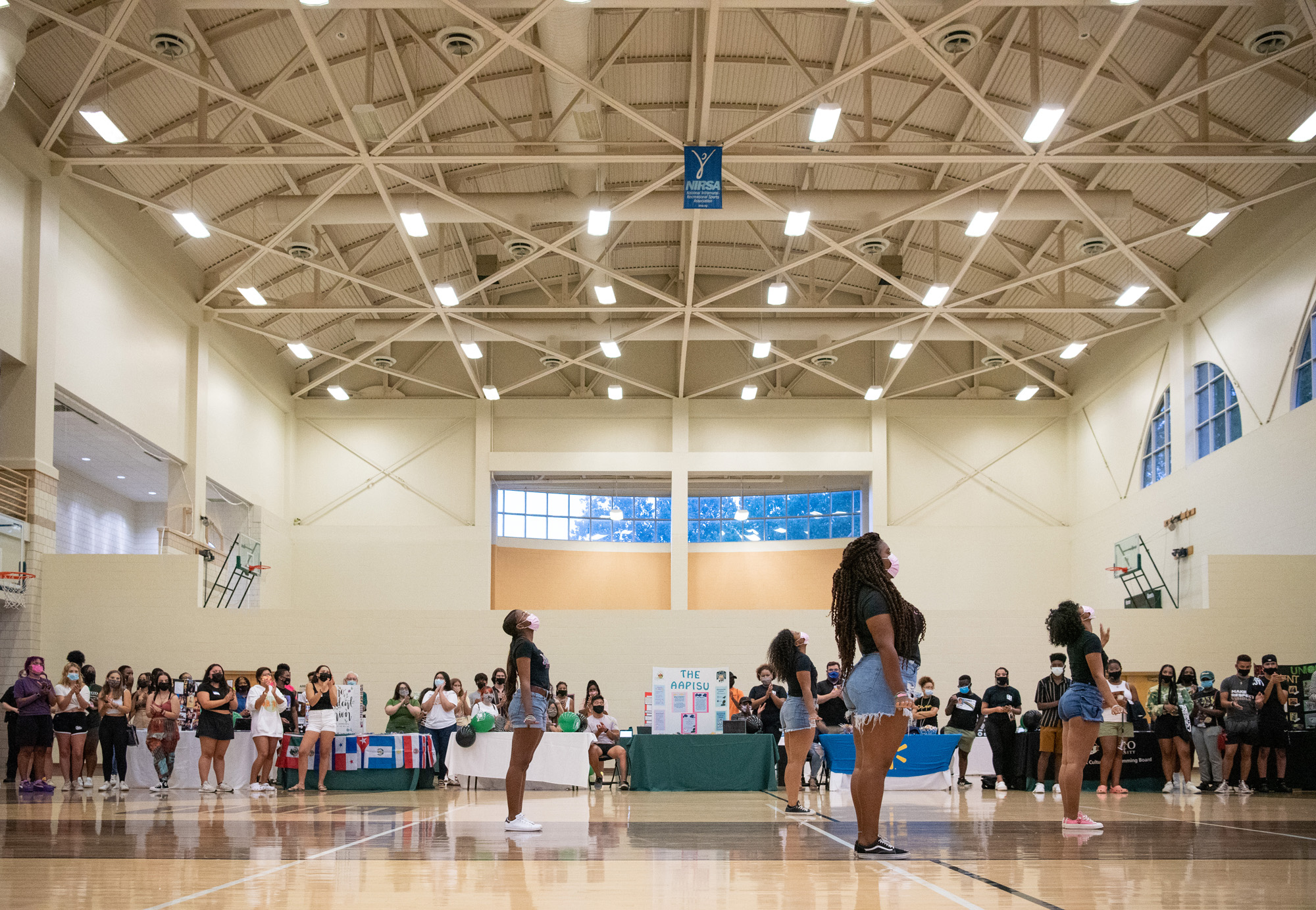 Performers dance in the Ping Center during a Multicultural Expo held for Welcome Week 2021