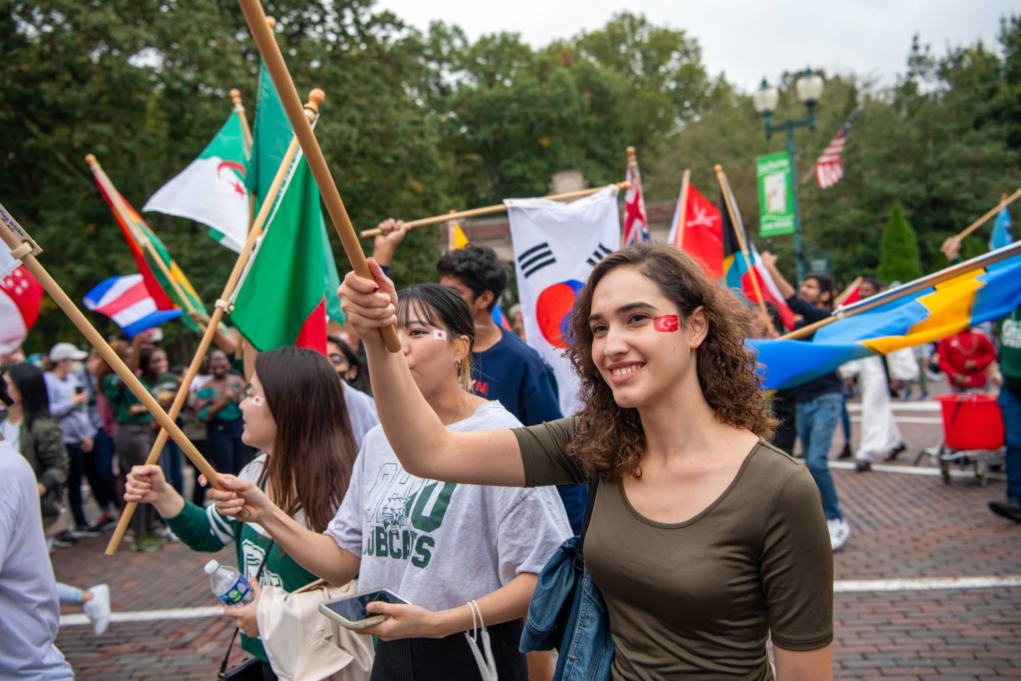 Students from the International Student Union participate in the Homecoming Parade. 