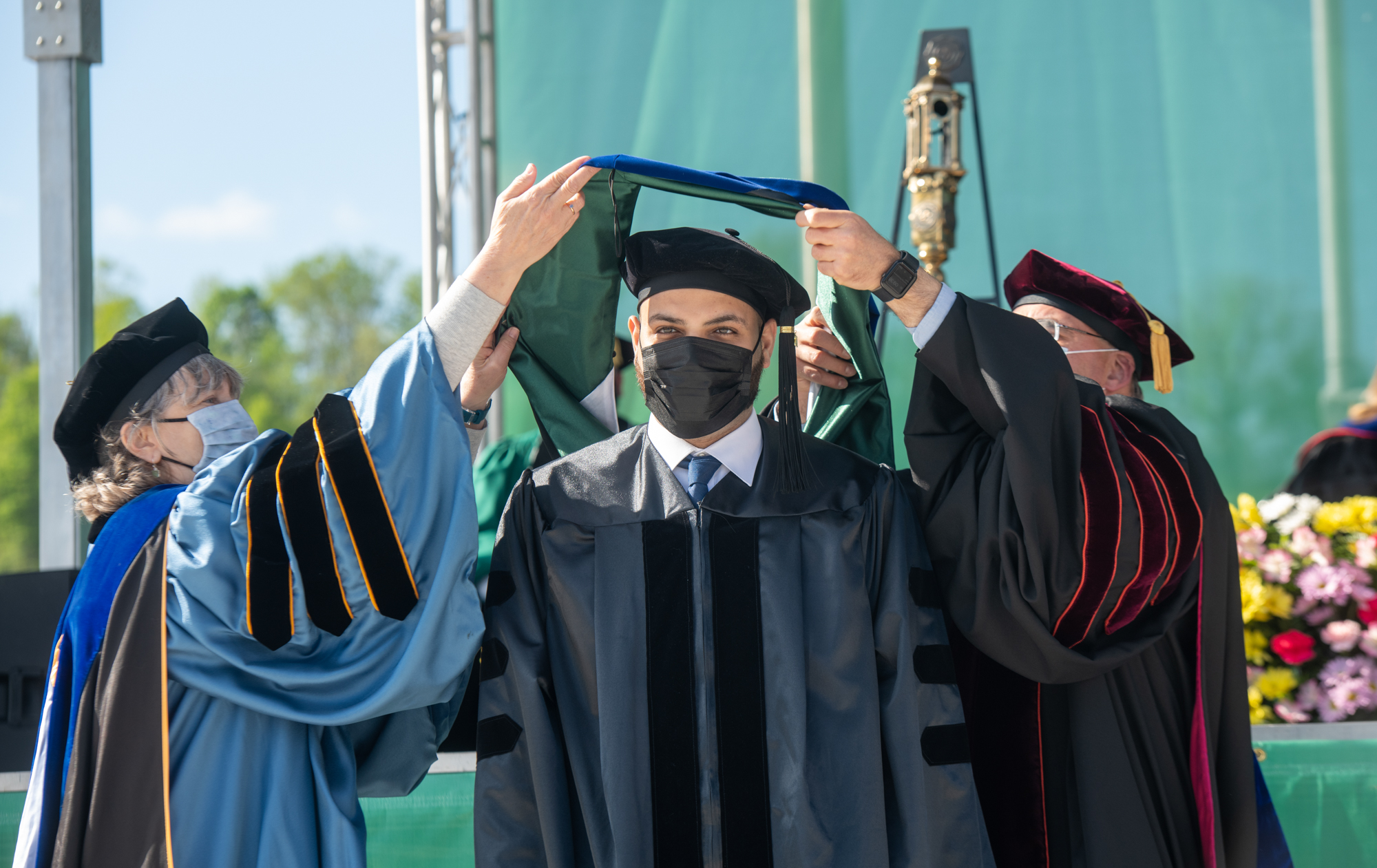 A recognized student receives an honoroary sash