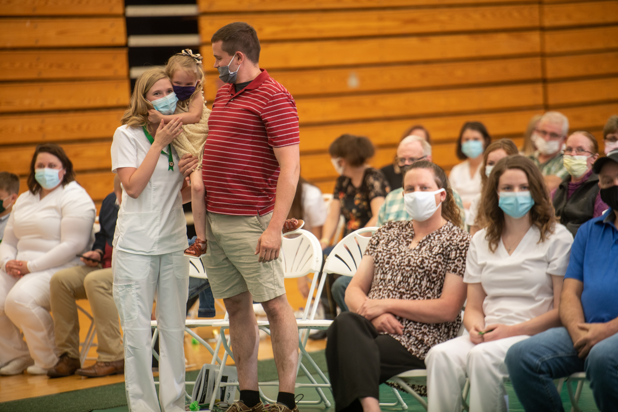 A family celebrates the graduation of nursing students