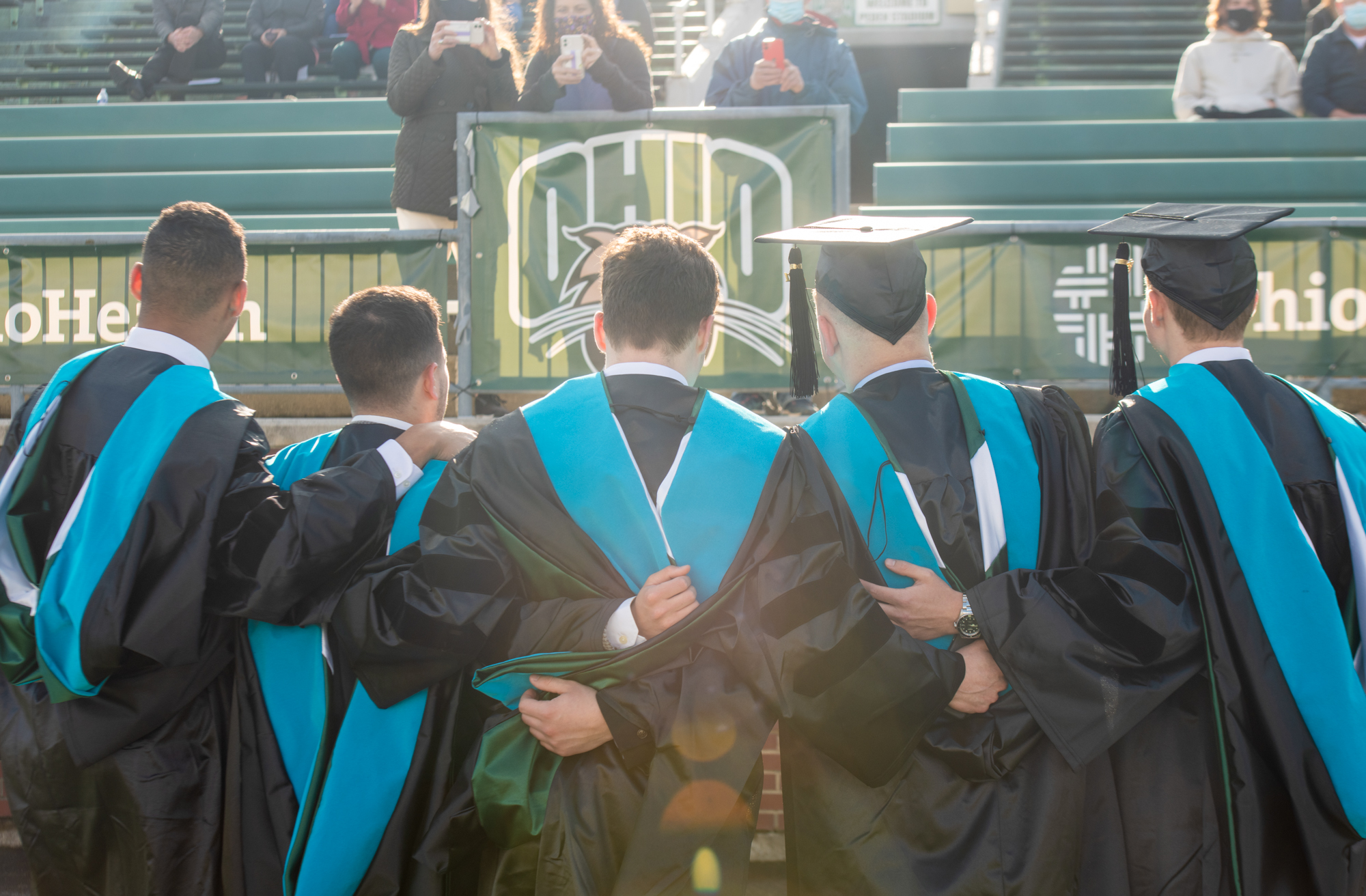 A group of graduates pose for a photo