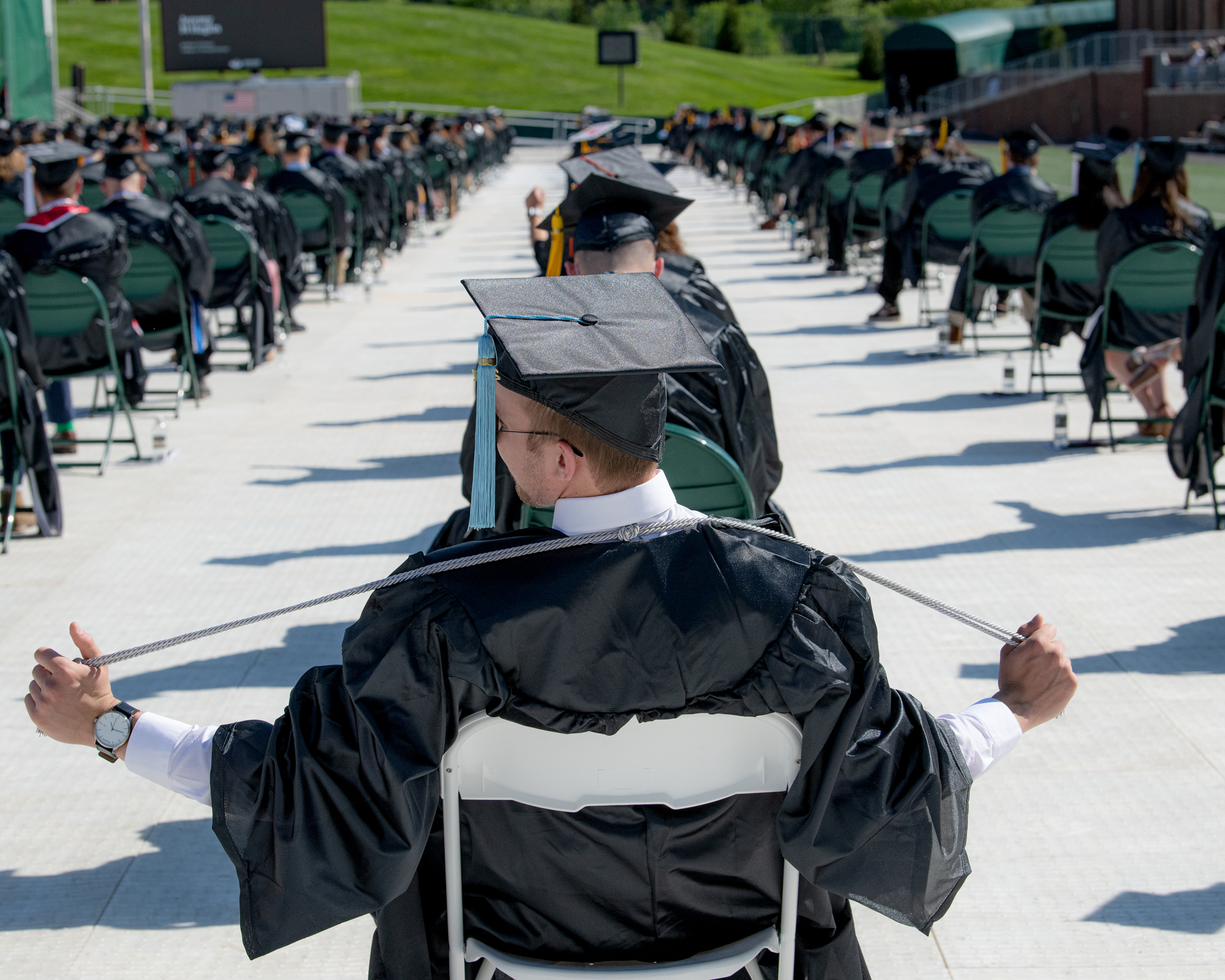 A view of the graduating student crowd from behind