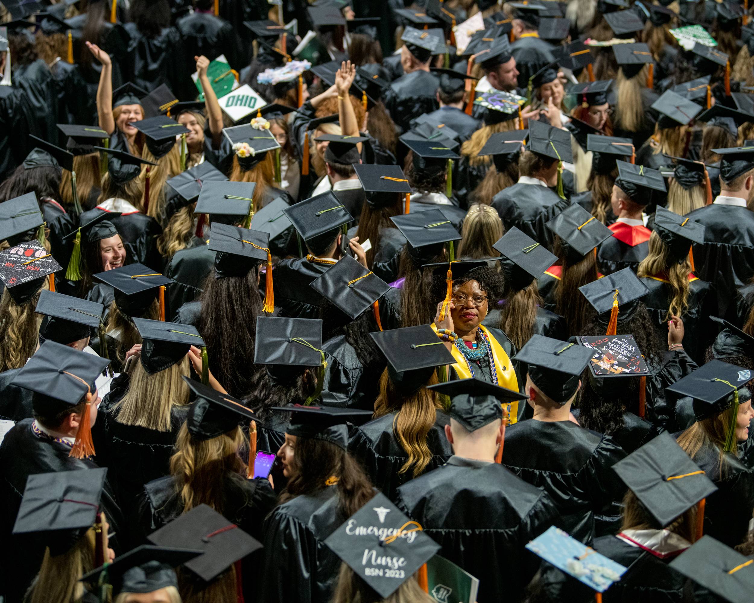 Graduating Bobcats spot faces of loved ones in the crowd cheering them on.