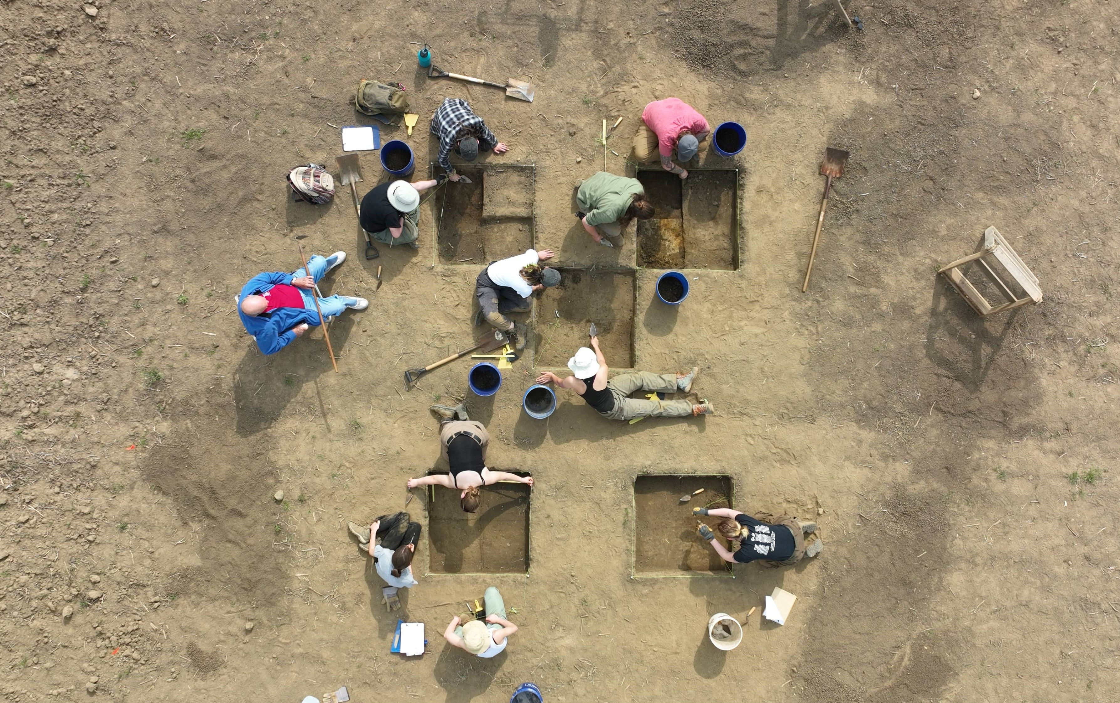 Using math and GIS: The OHIO students used the Pythagorean theorem to create perfect one-meter-by-one-meter square units. They also set up a datum, which is a permanent reference point so researchers can find that exact locations of the test units. Photo by Ben Siegel