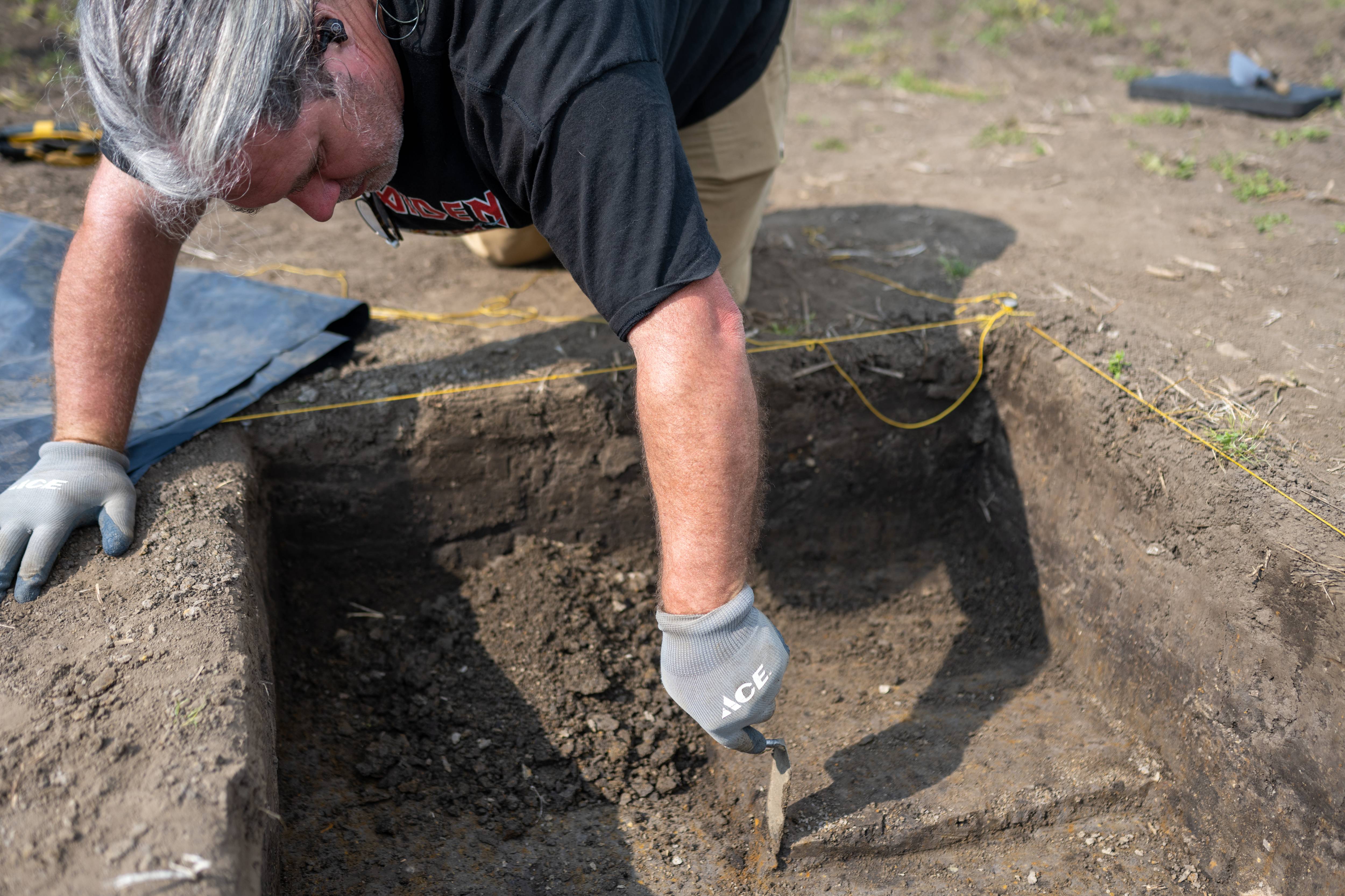 Making amazing discoveries: David Lamp used a trowel to dig layer by layer, where one of his finds was a once-in-a-lifetime Clovis point. Photo by Ben Siegel