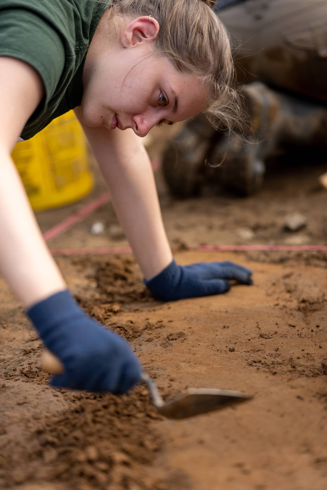 Student Tori Lovelace excavates on 12,000 year old surface.