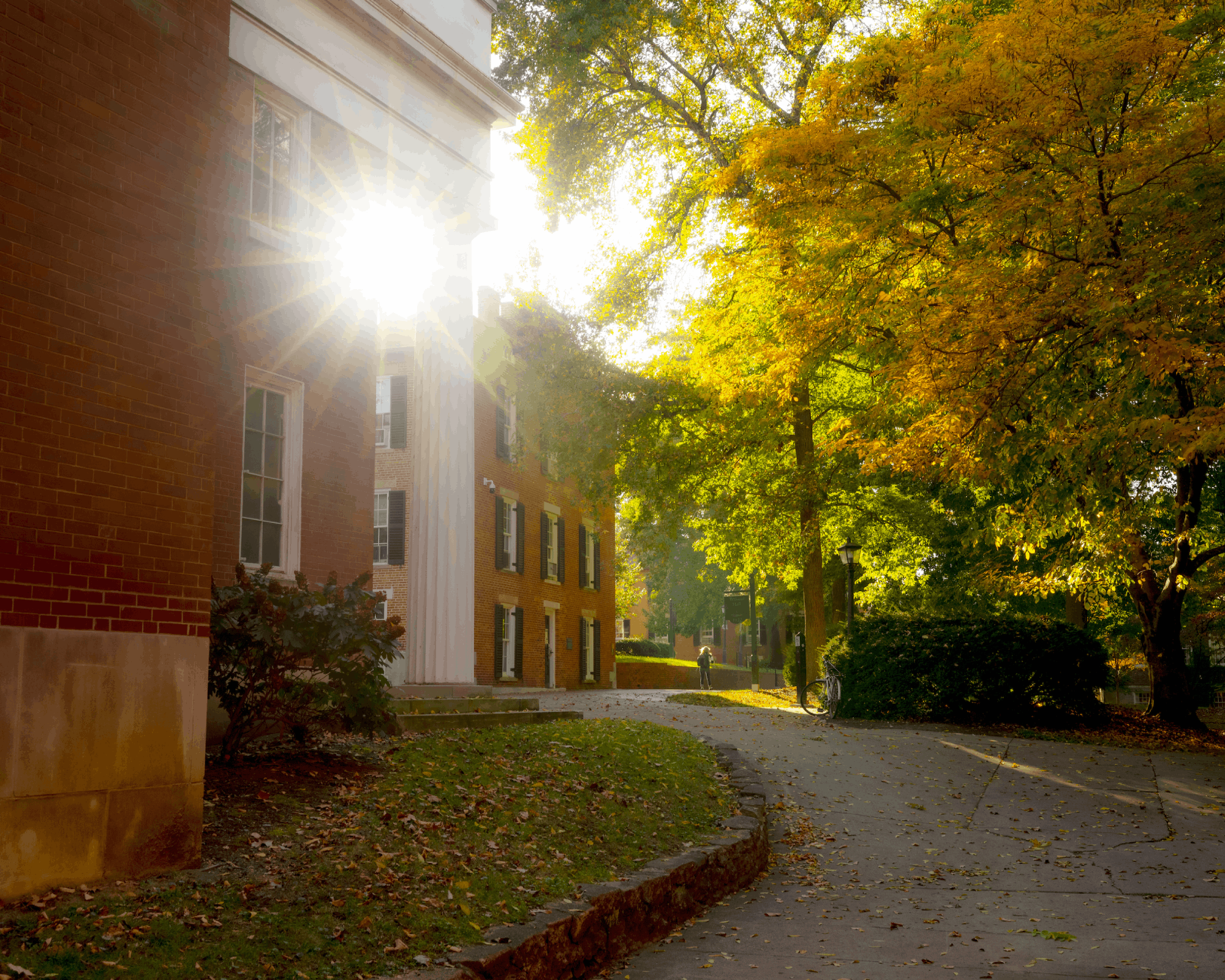 A student walks across College Green near Galbreath Chapel.