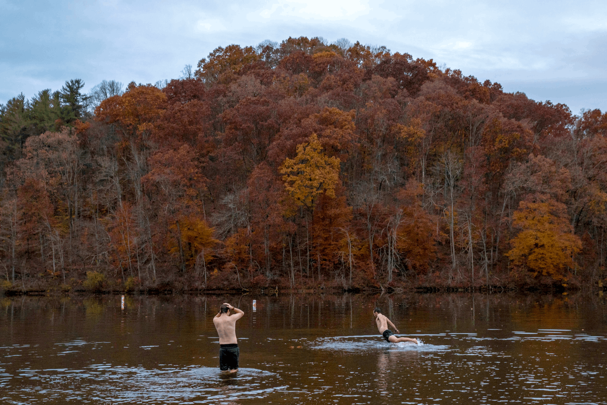 Students enjoy some bonus time swimming in Strouds Run State Park during unseasonably warm fall temperatures.