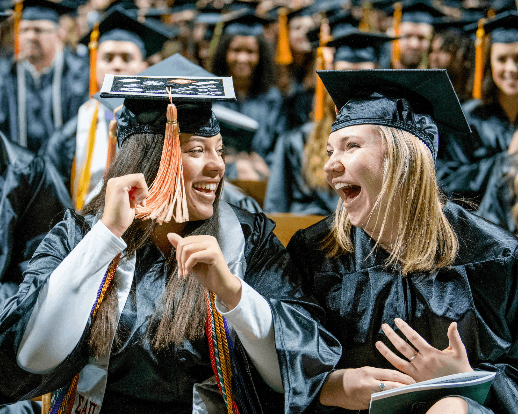 Graduates react during Fall Commencement.
