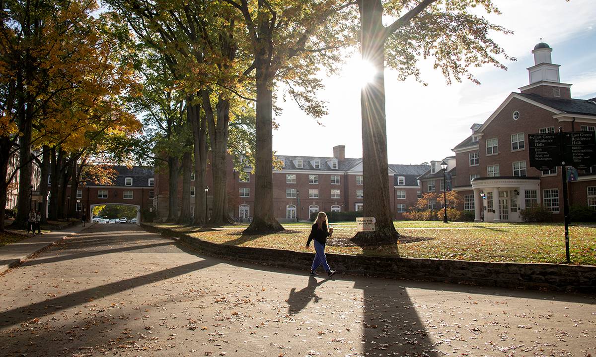 A student walks on East Green