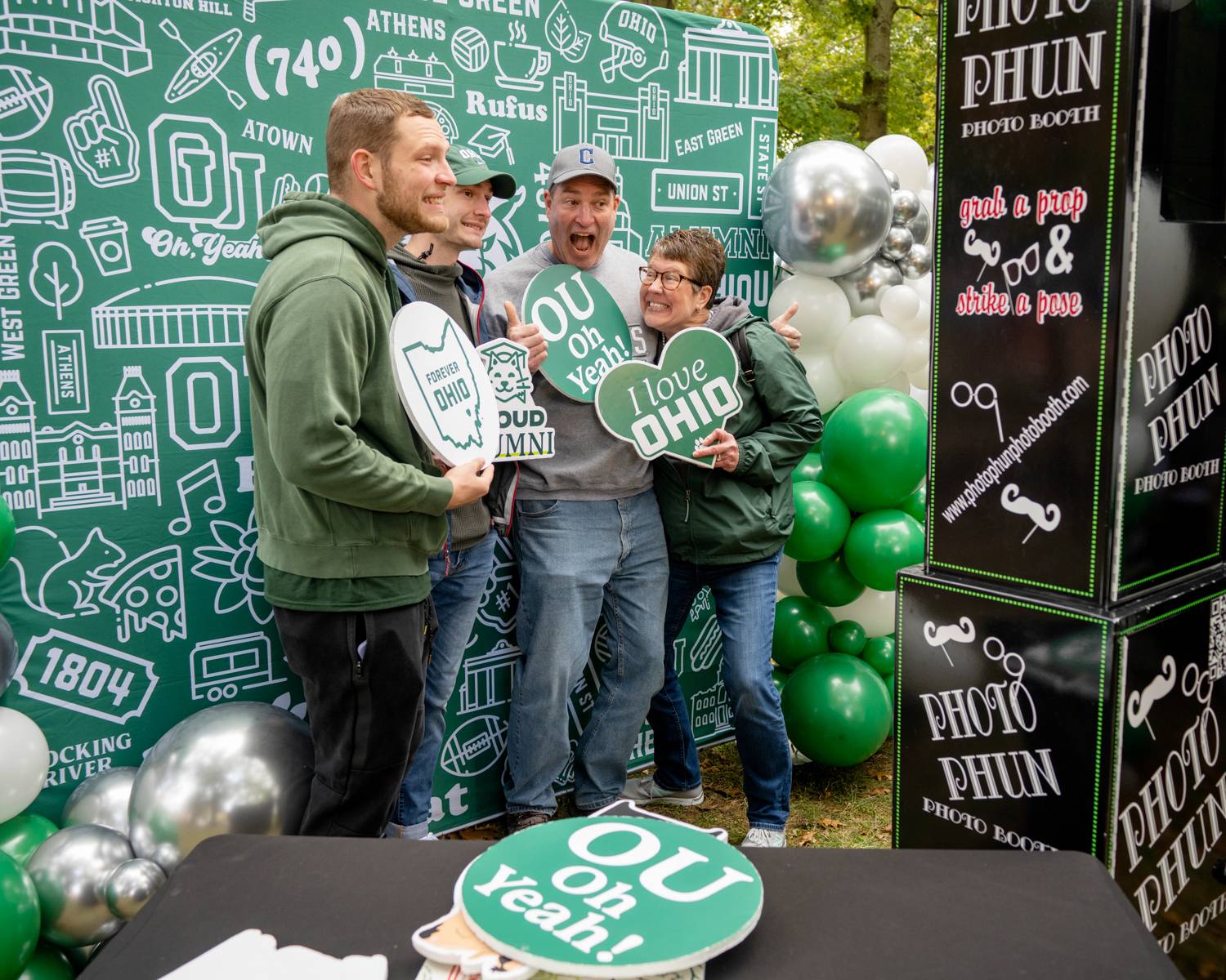 Alumni pose for photos during Homecoming festivities on College Green.