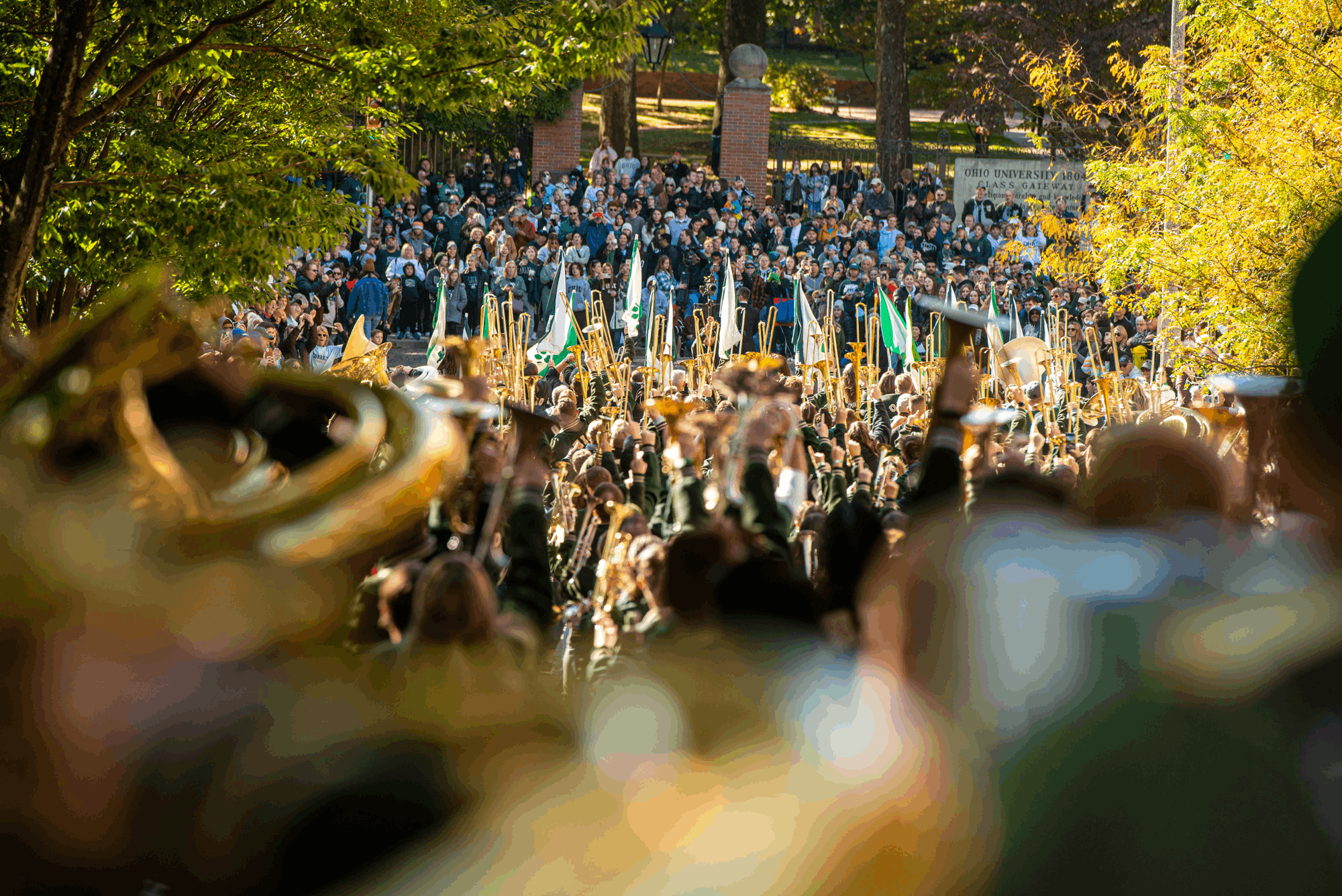 The always-popular Marching 110 Alumni Band makes its way toward an enthusiastic crowd gathered at Ohio University’s Class Gateway.