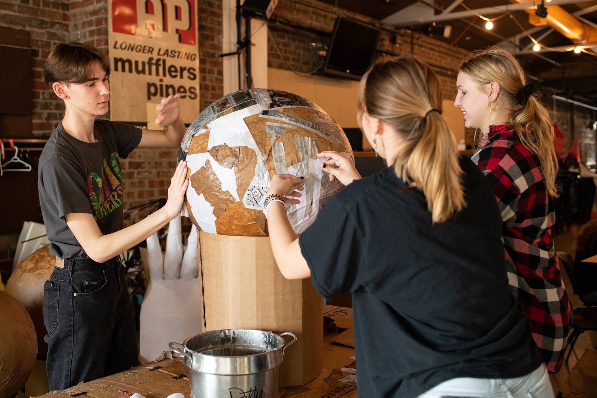 An Ohio University learning community works together at the Central Venue to create pieces to be used in the Honey for the Heart parade in Athens, Ohio.