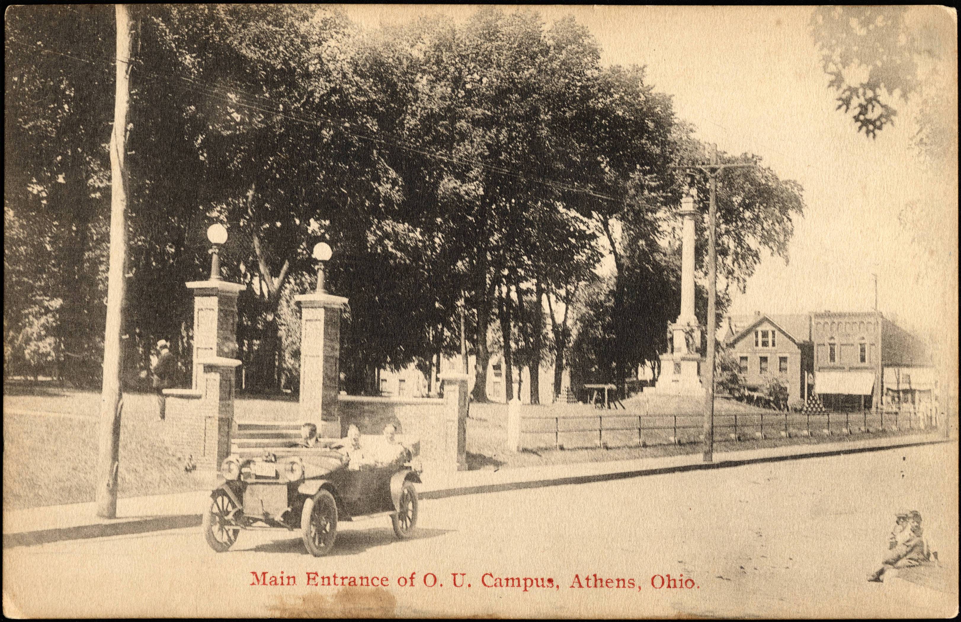 This photo, circa 1920, shows the main campus entrance and the monument, seen on the right with its cannon and cannonballs. Photo courtesy the Mahn Center for Archives & Special Collections