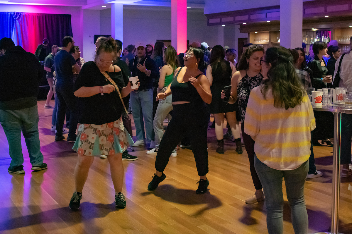 People dance to the live DJ set at the Ohio University Music Industry Summit opening night party at Stuart's Opera House.