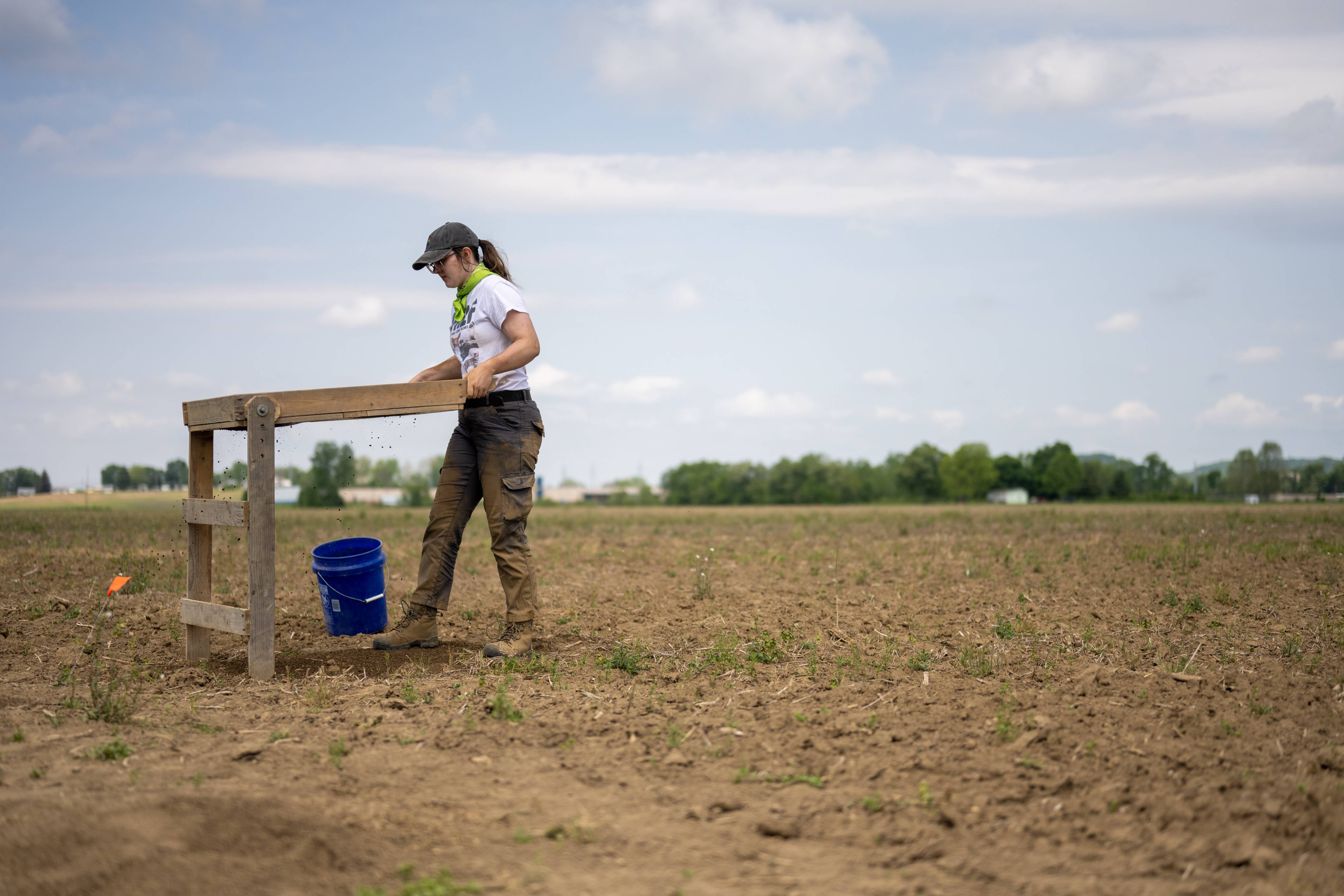 Student Lizzie Clark screens sediment from the field school’s excavation.