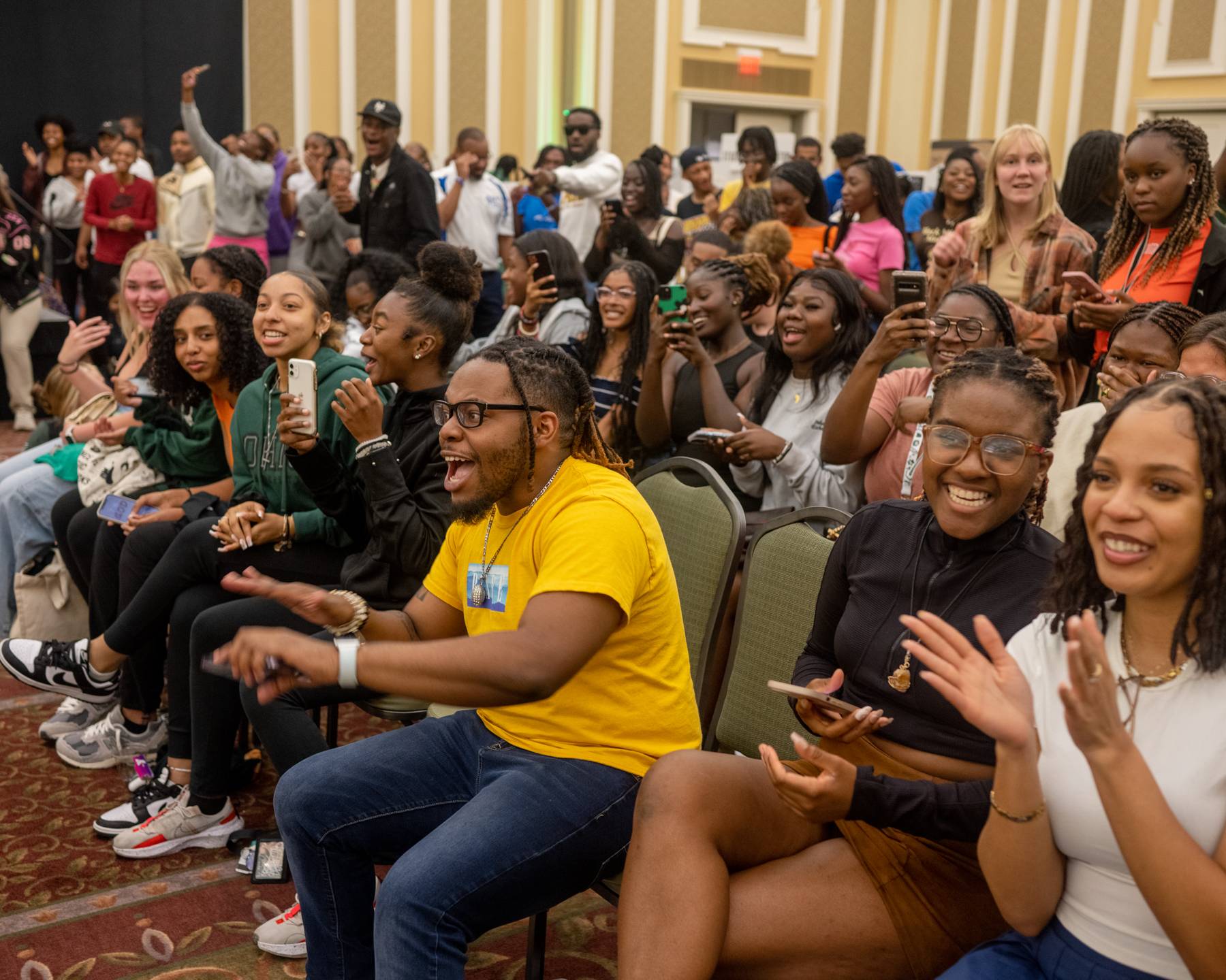 Students react to a performance at the Multicultural Student Expo in the Baker Ballroom