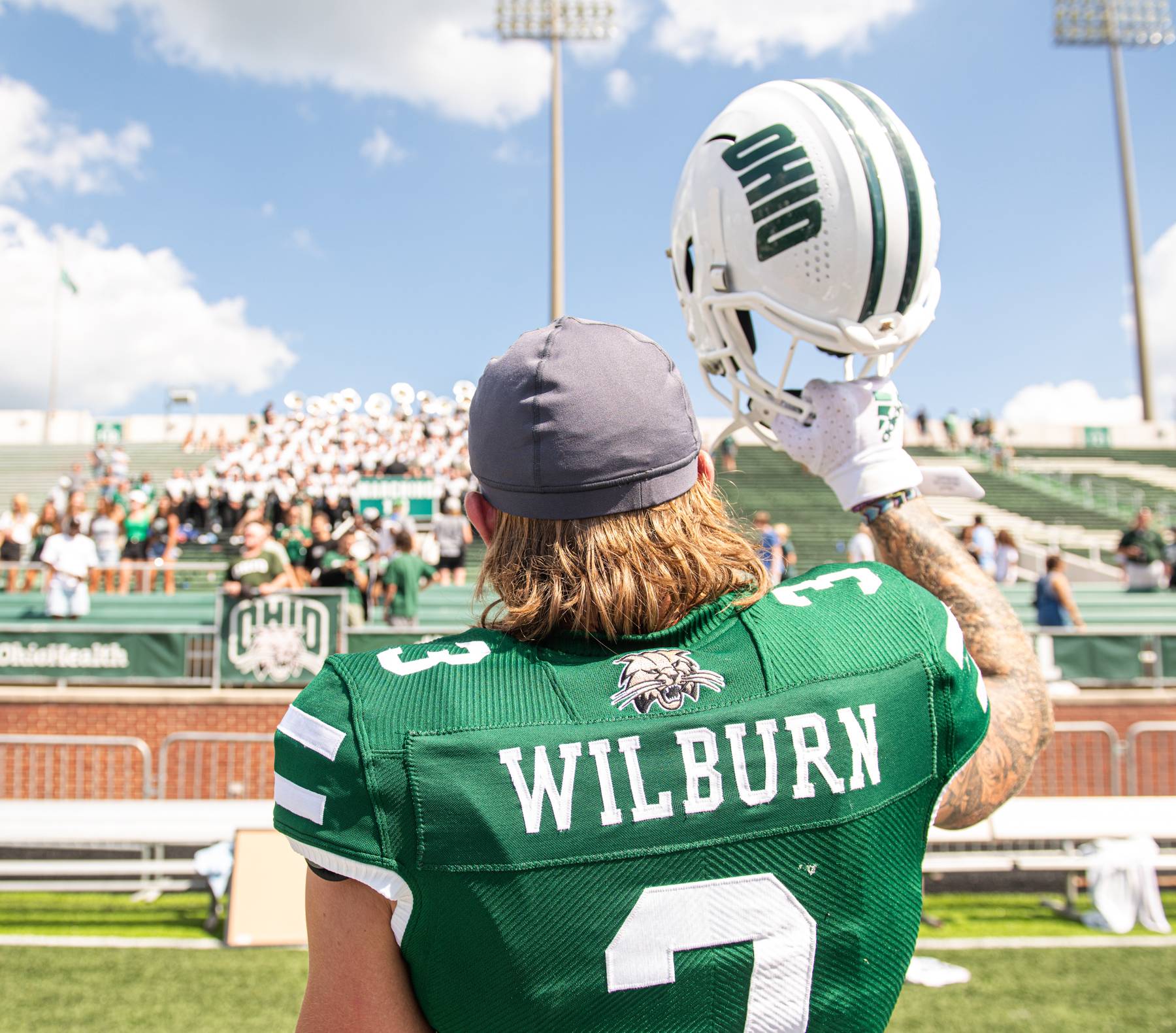 OHIO football player Keegan Wilbur cheers his team during their first home game of the year