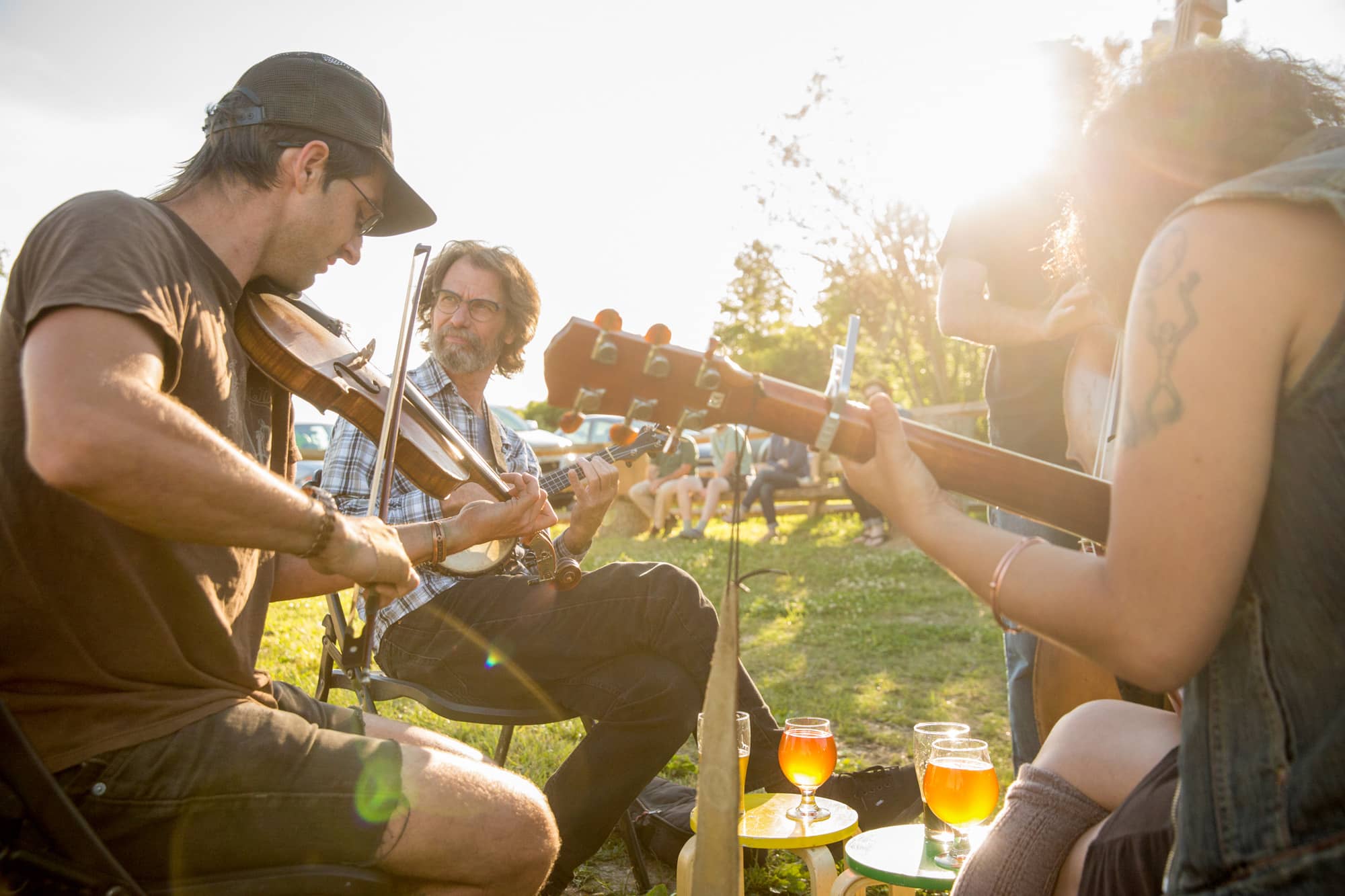 There is never a dull moment in Athens County as outdoor events continually populate the city and surrounding community. Shown here are musicians taking part in the Old Time Jam on the grounds of Little Fish Brewing in Athens.