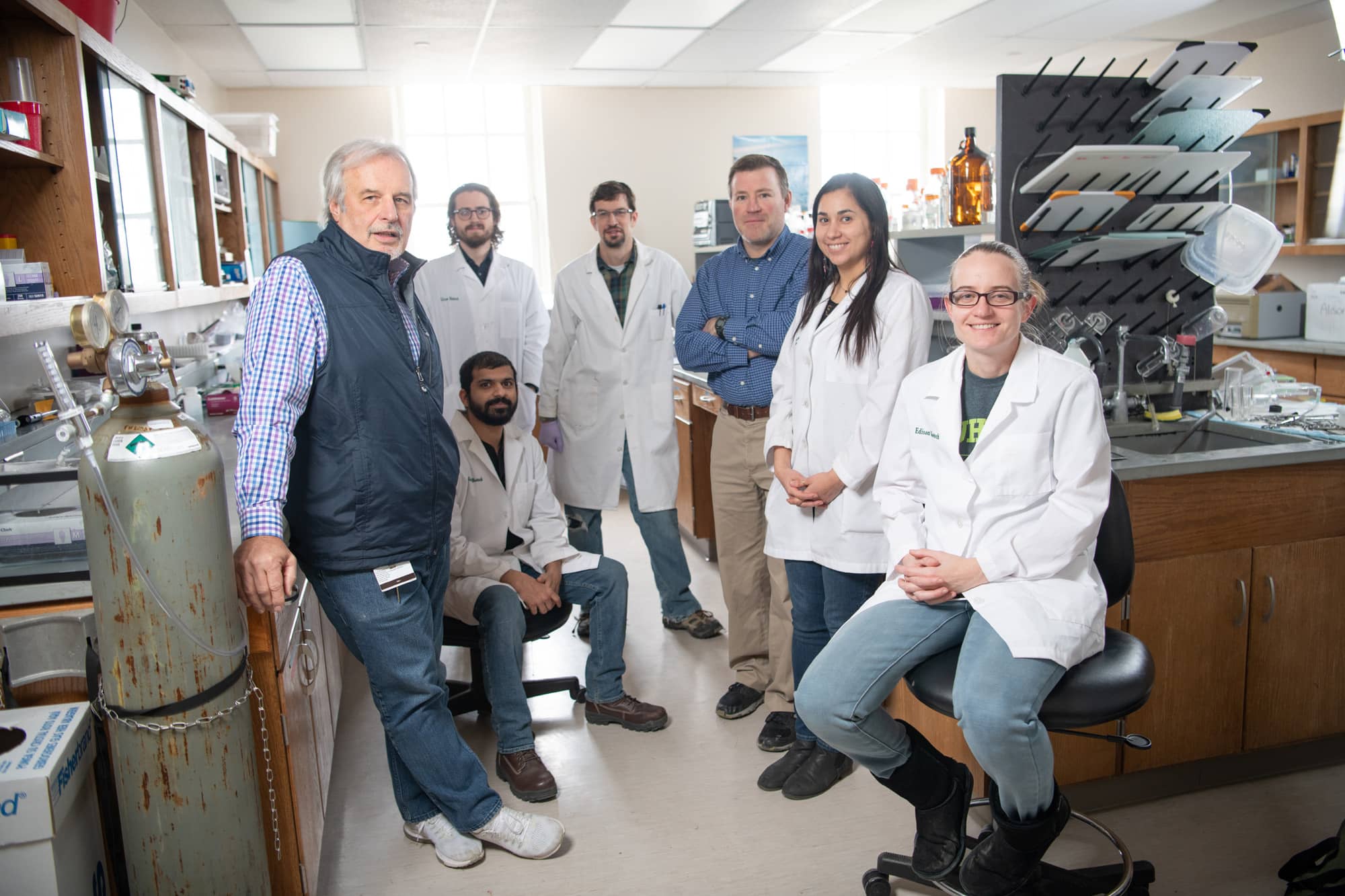Dr. John Kopchick poses for a photo with his team at the Edison Biotechnology Institute.