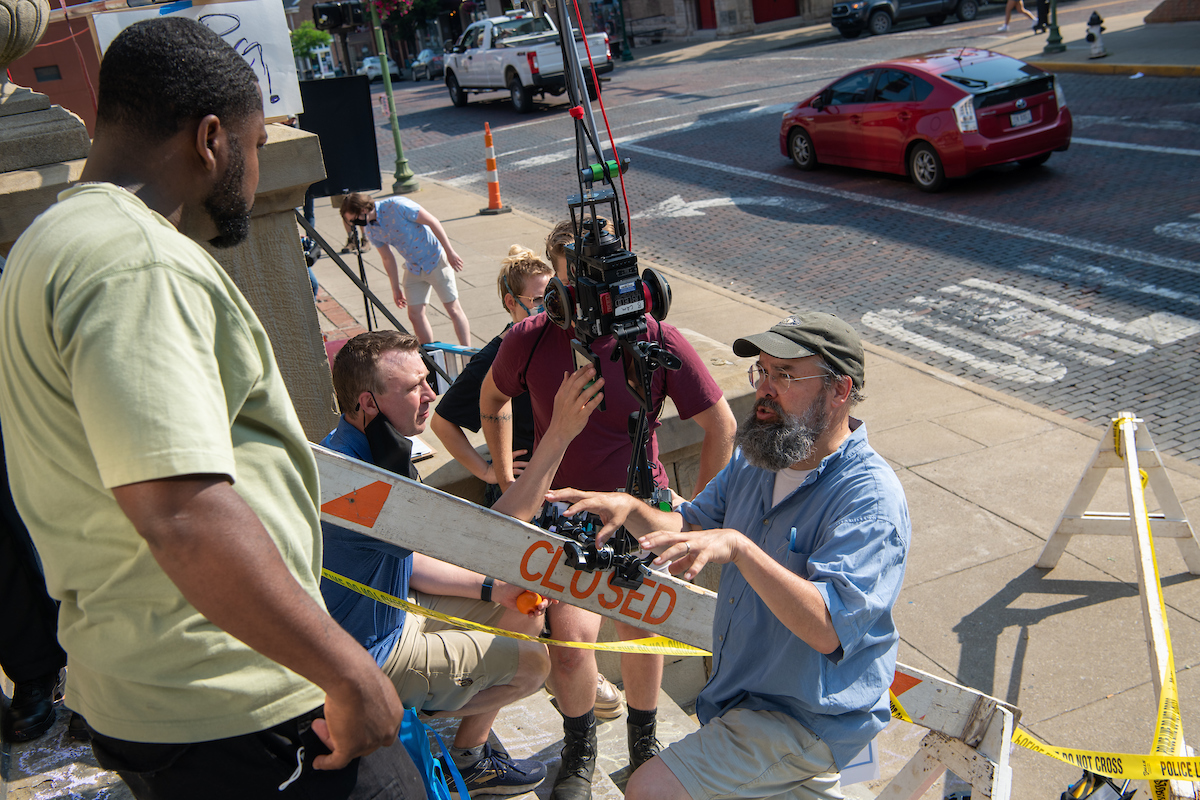 Eric Williams directs cast and crew on the steps of the Athens County Courthouse