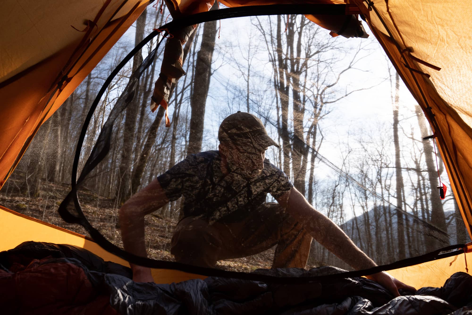 Eamonn Bell lays his sleeping bag in our tent during his first night backpacking a section of the Appalachian Trail in the Nantahala National Forest on Saturday, March 5, 2022, at the Rock Gap campground near Franklin, North Carolina.