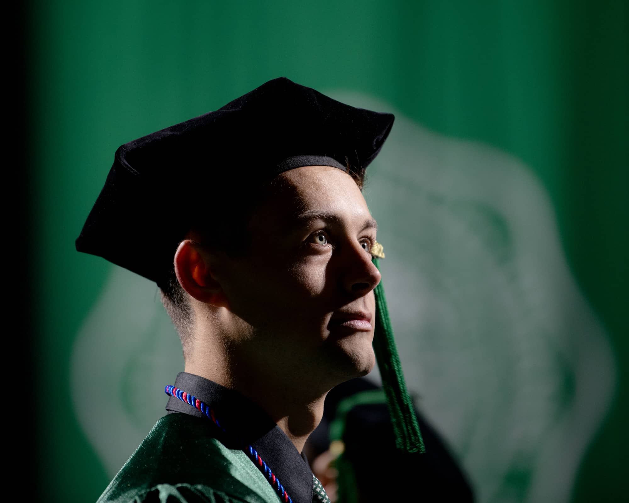 A Heritage College student participates in commencement at the Convocation Center.