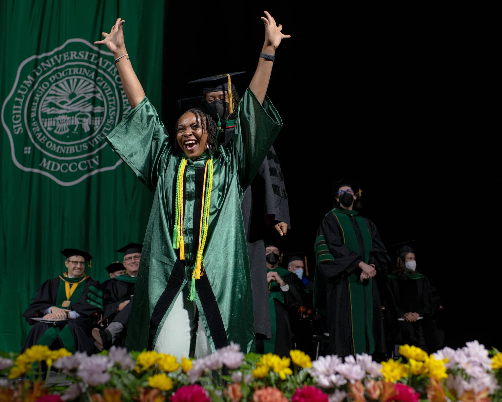 A student reacts during commencement for the Heritage College of Osteopathic Medicine.