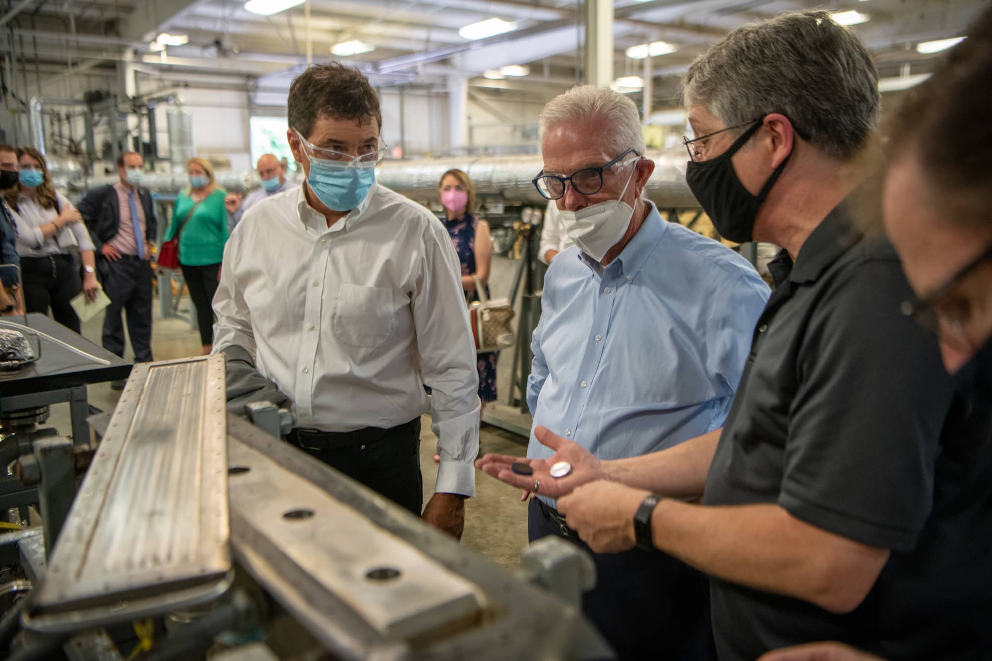 Congressmen Troy Balderson (left) and Bill Johnson (center) speak with Dr. Bruce Brown at the Institute for Corrosion and Multiphase Technology to learn more about the institute's economic impact on the region.