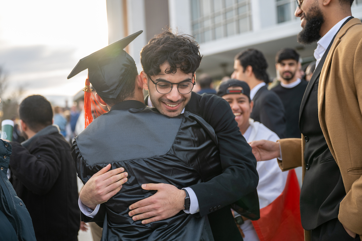 Graduates embrace following the Fall 2023 commencement ceremony
