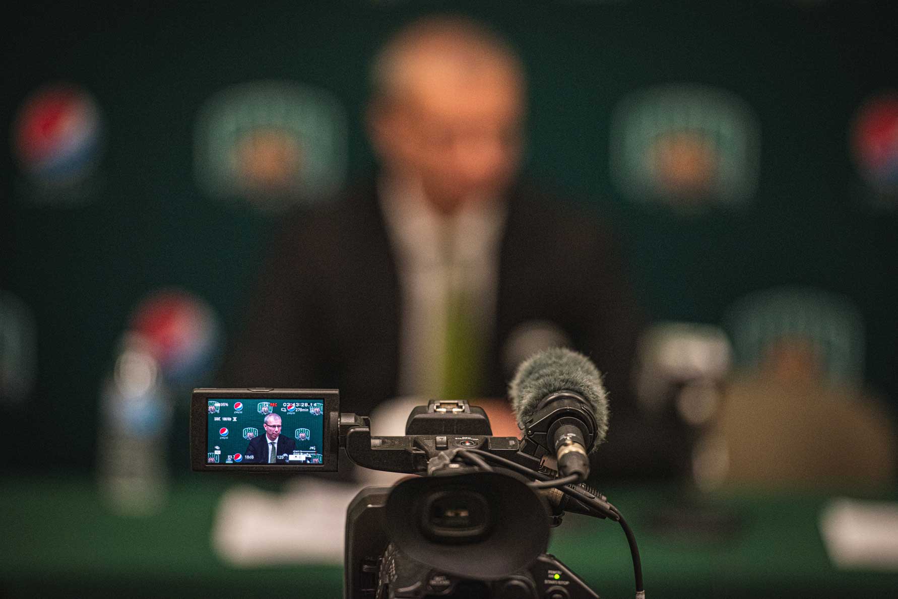 Out of focus Jeff Boals in the post-game press conference