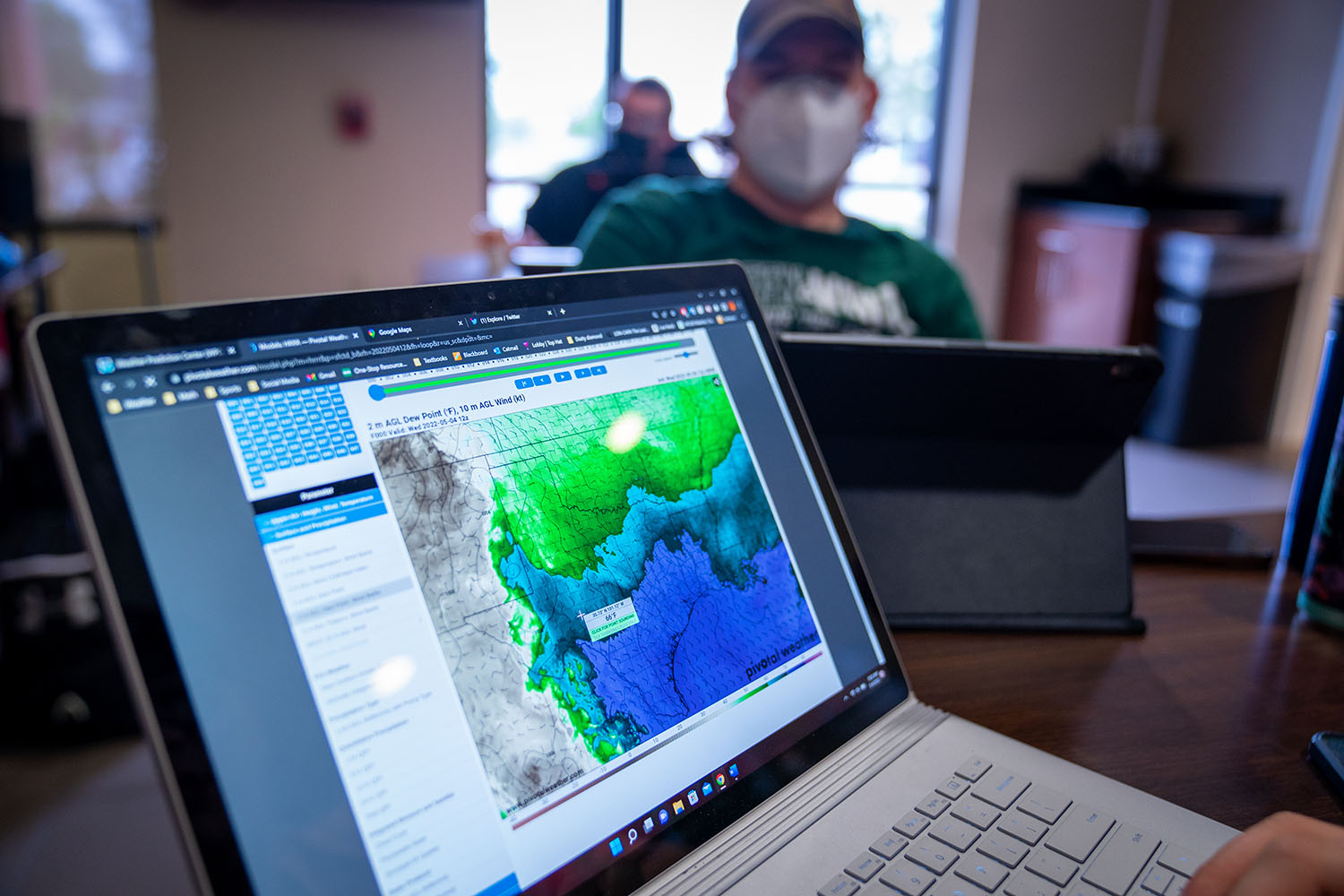 Students monitoring weather radar and patterns before heading out to chase the storms.