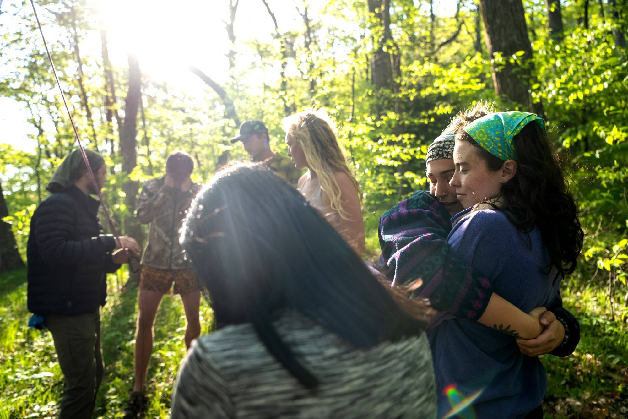 Autumn Warren (left) and Emelia Adams share a hug on the trail. The students grew close during the 28 days they spent together in the wilderness.
