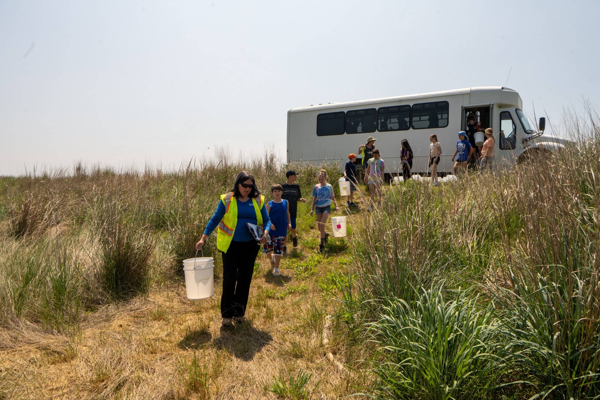 Senior Environmental Specialist Kristina Motley directs local grade school students on Poplar Island. Motley is collaborating with Dr. Roosenberg's team in an environmental education program called TERP (Terrapin Education and Research Partnership).