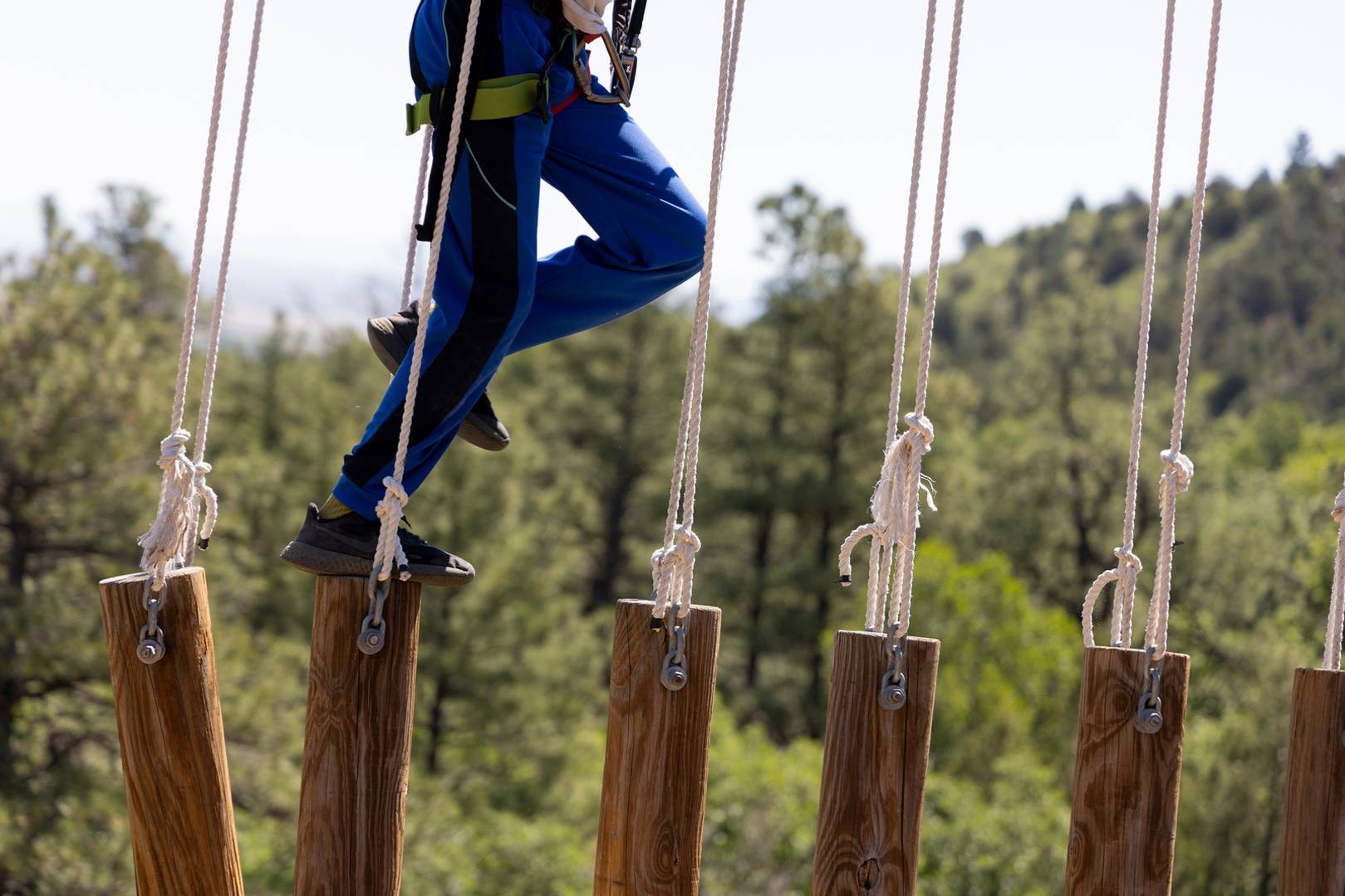 Philmont Training Center participants challenge themselves on a COPE course near the Tooth of Time in Cimarron, N.M., on June 29, 2022.
