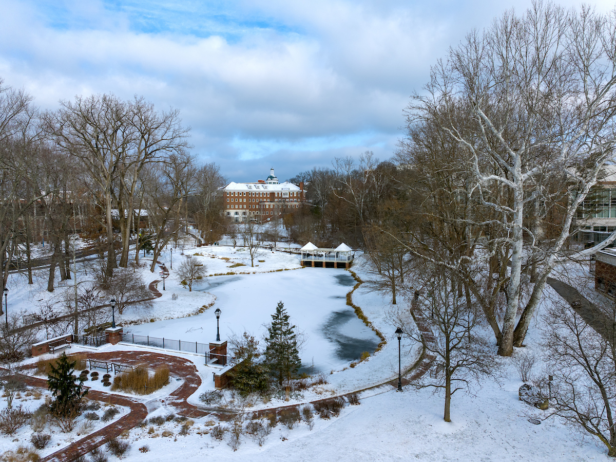 A view of snowy campus with Emeriti Park in the foreground