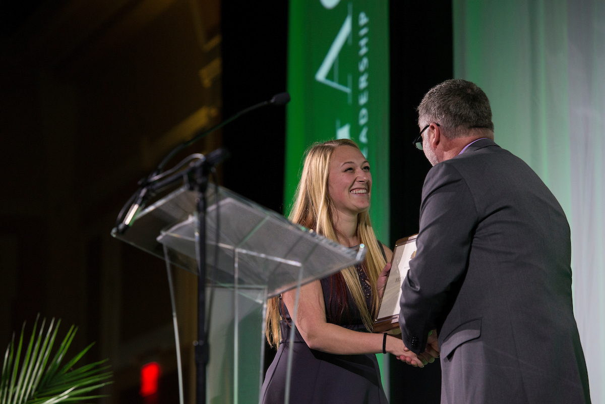 An OHIO student receives an award at the Leadership Awards event