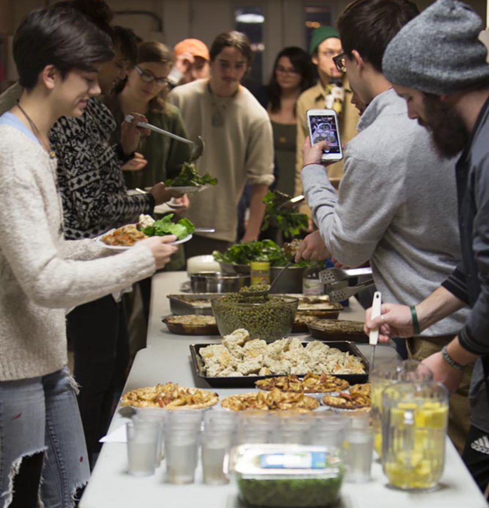 OHIO and Athens community members fill their plates at a United Campus Ministry Vegan Cooking Night event in Athens. Photo by Alexandria Polanosky, BSVC ’17