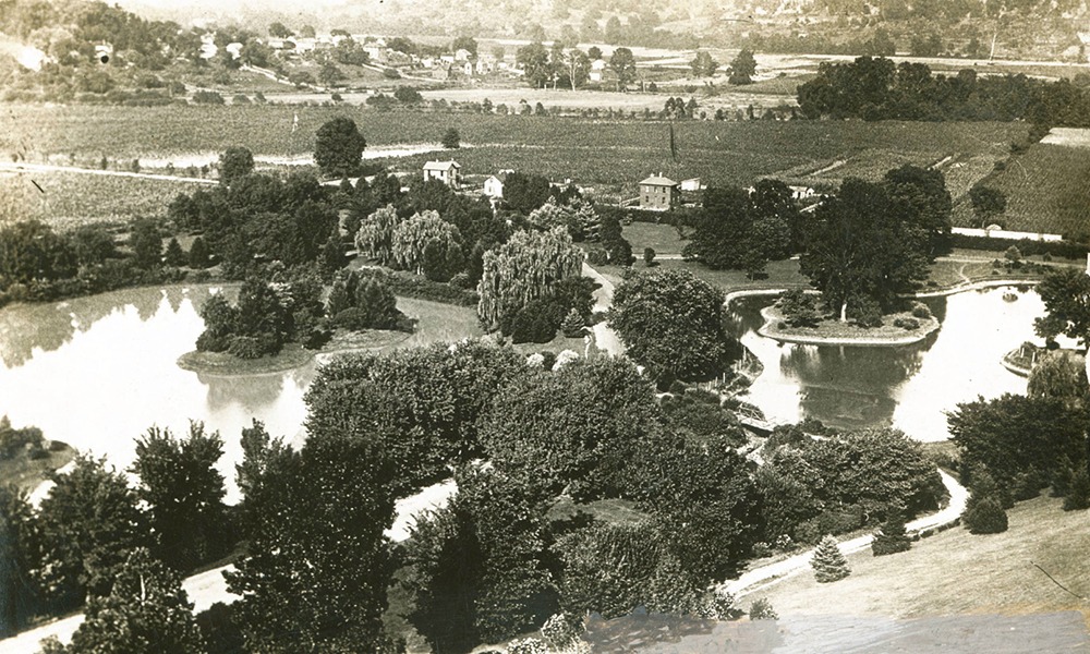 aerial view of the ridges. multiple lakes and tree tops. a couple of houses