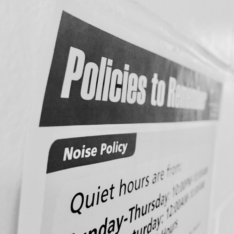 Sign says: Policies to Remember... Noise Policy; Quiet hours are from...