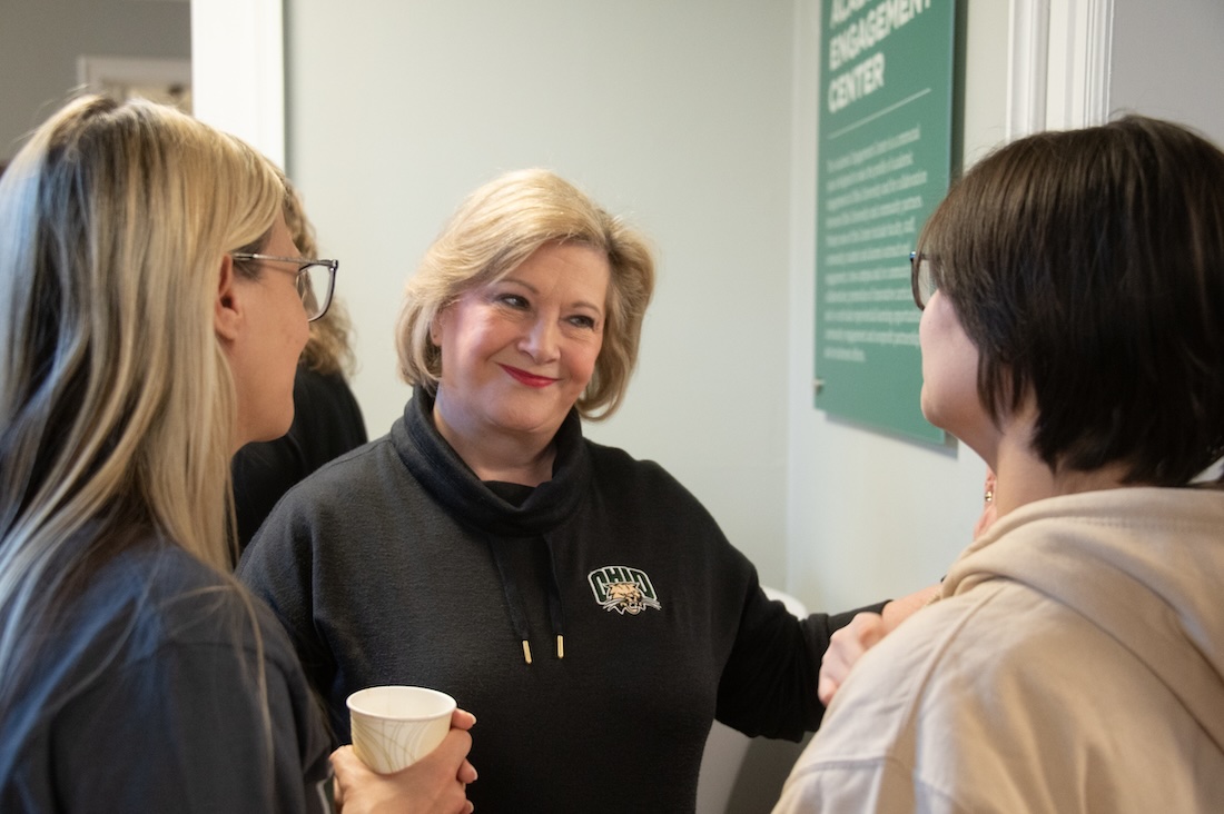 President Gonzalez speaks to two people during a reception