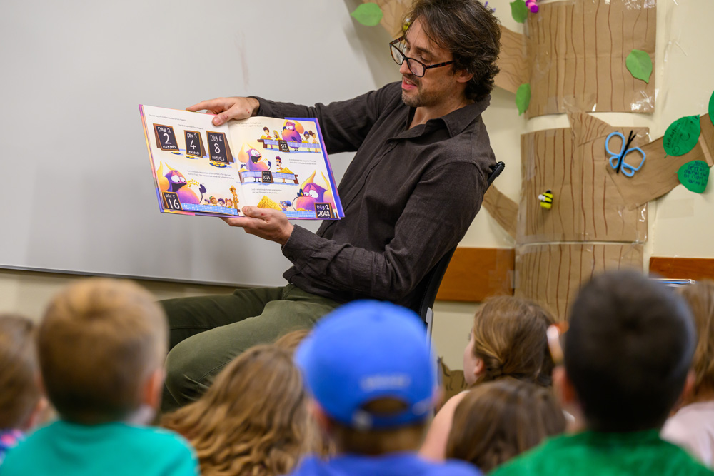 Teacher reading to the campers.