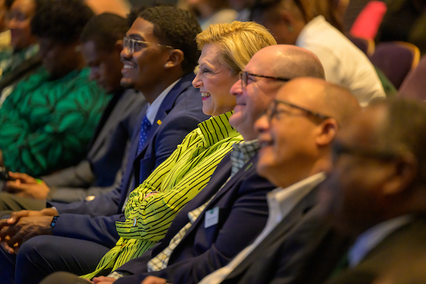 President Lori Stewart Gonzalez, Randy Gonzalez and other audience members listen during the lecture