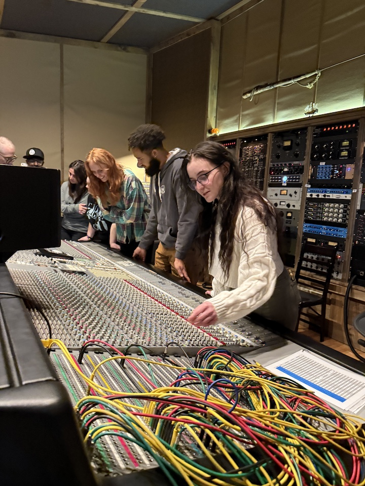 Students working with equipment in professional industry