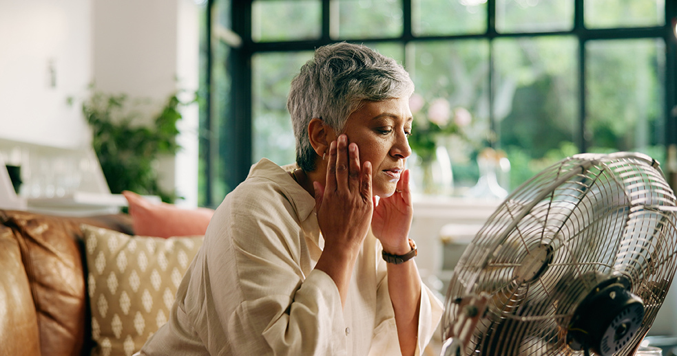 Woman in front of fan
