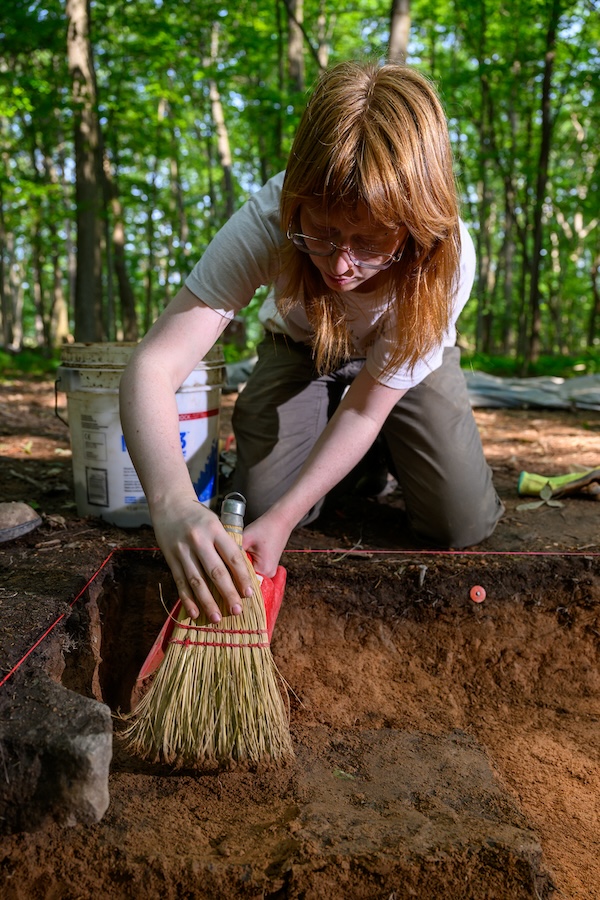 A student excavating the land on the Shoop Paleoindian site.
