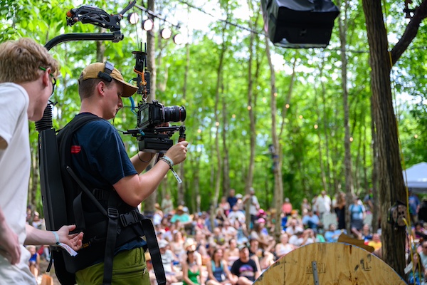 Student working behind camera